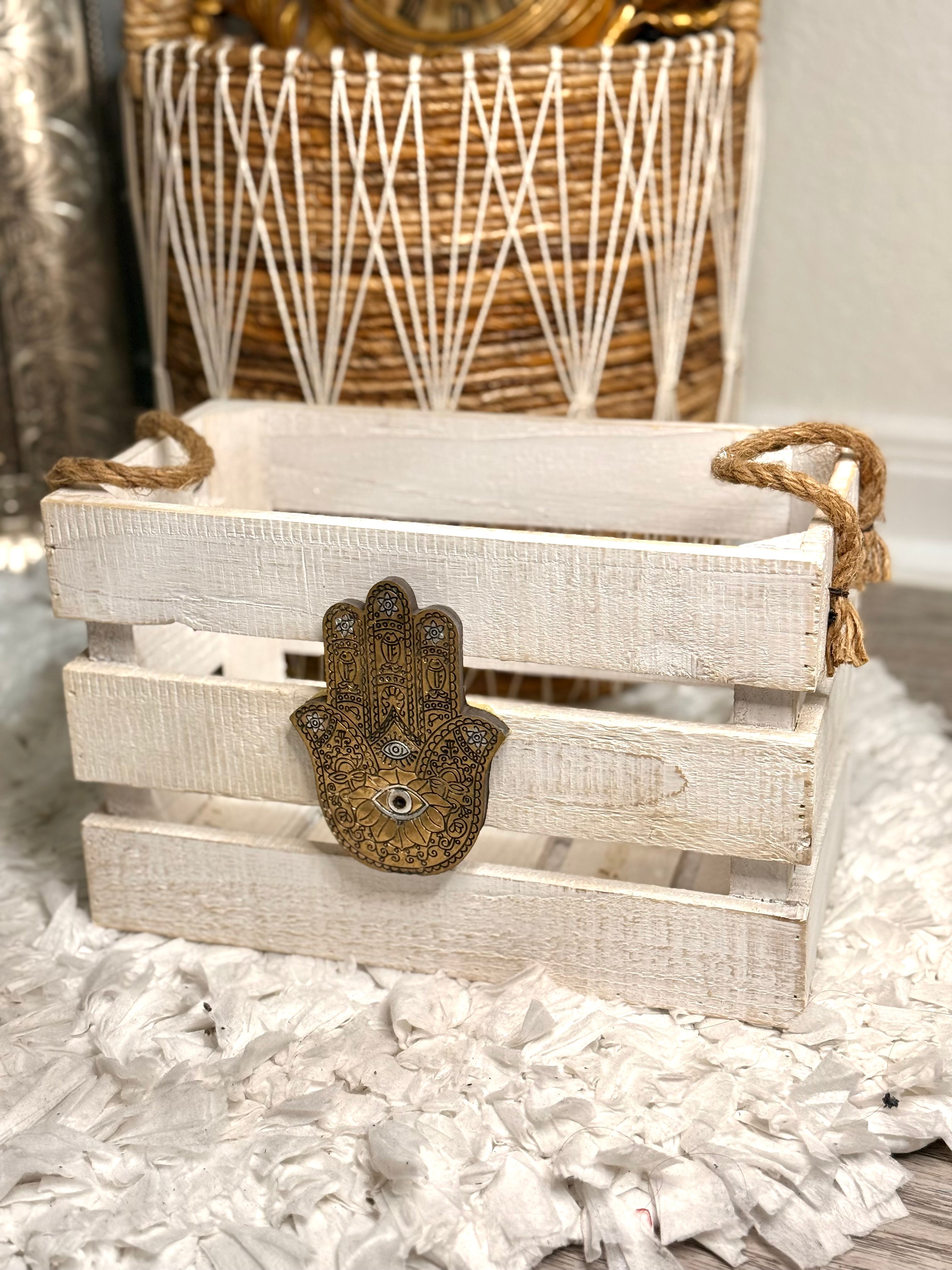 Hand-painted antique gold wooden crate featuring Hamsa and all-seeing eye symbol, ideal for boho home storage and display.