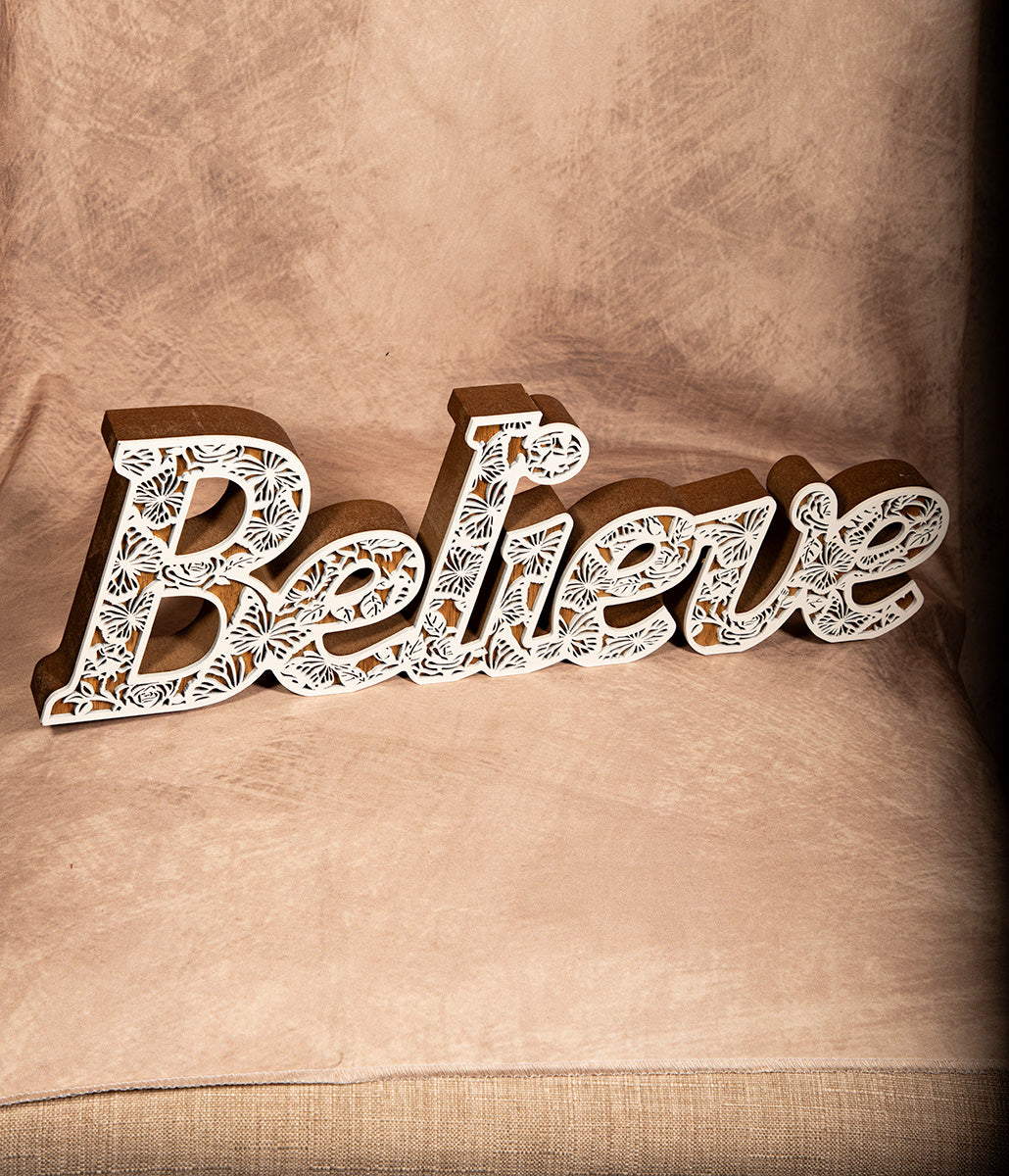 Believe wooden wall sign with subtle shimmer finish, inspirational home decor accent.