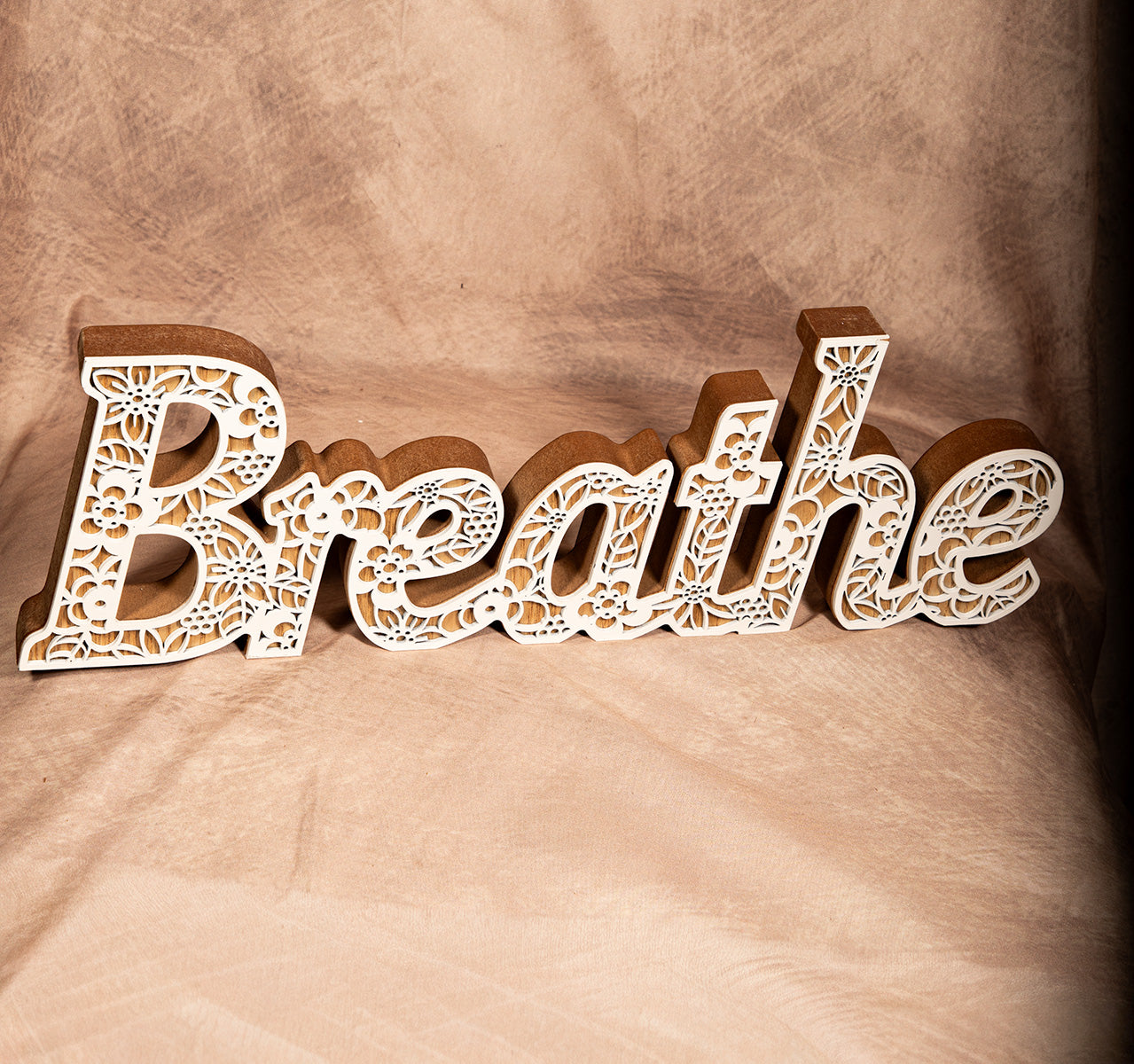 Rustic wooden “Breathe” wall sign with white mosaic detail, inspirational home decor accent.