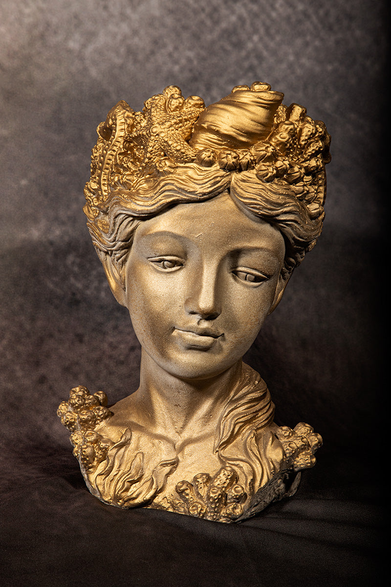 Gold mermaid goddess bust with seashell crown, coastal mythology art sculpture.