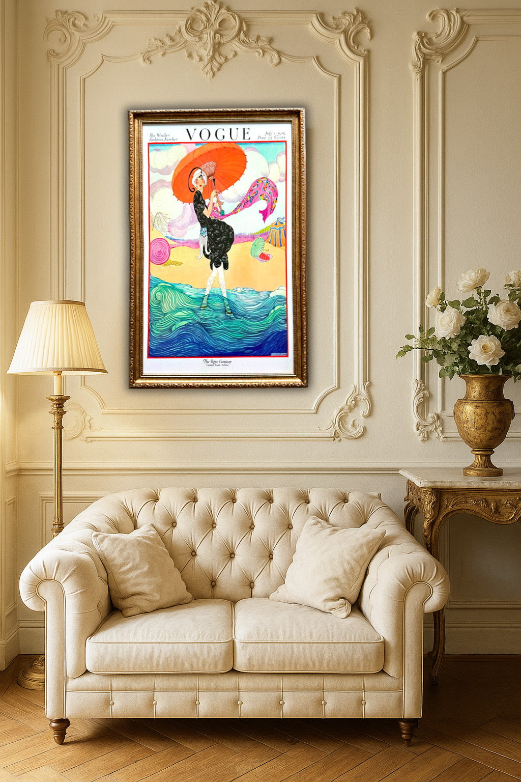 Decorative living room with a framed Vogue poster, beige sofa, and lamp.