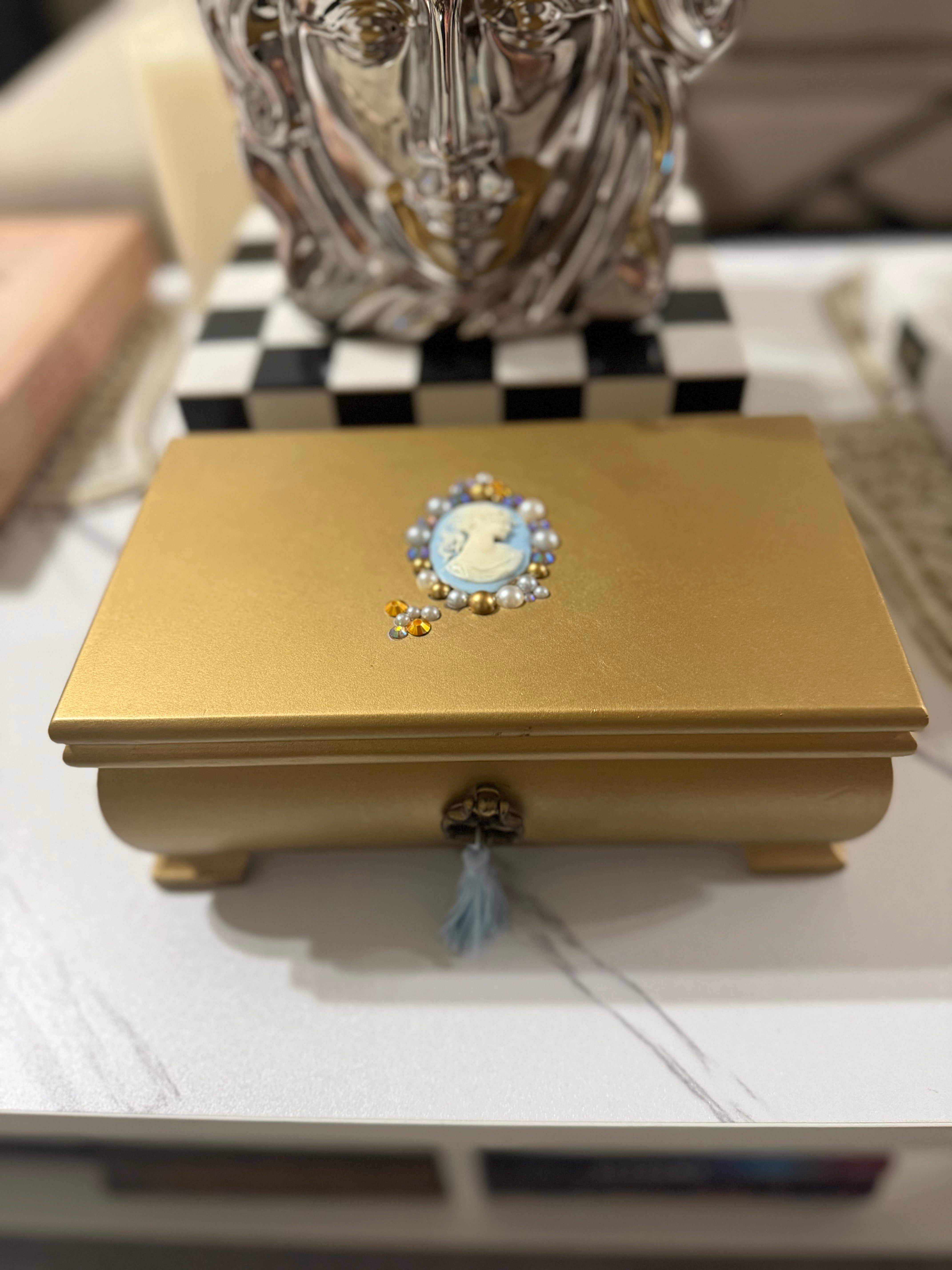 Gold baroque cameo jewelry box with pearls, vintage vanity decor for classic bedroom styling.