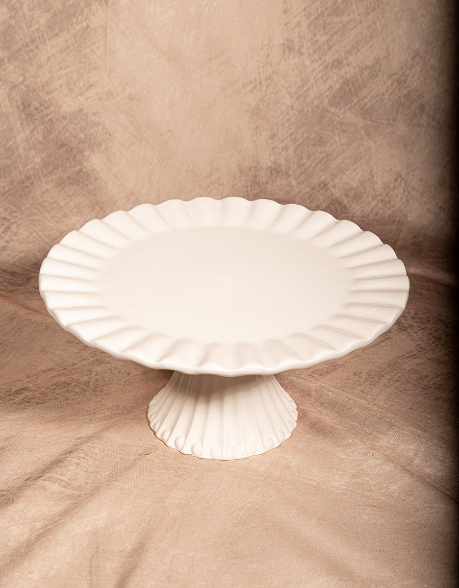 White porcelain fluted cake stand pedestal plate, elegant serving piece for desserts or home decor.