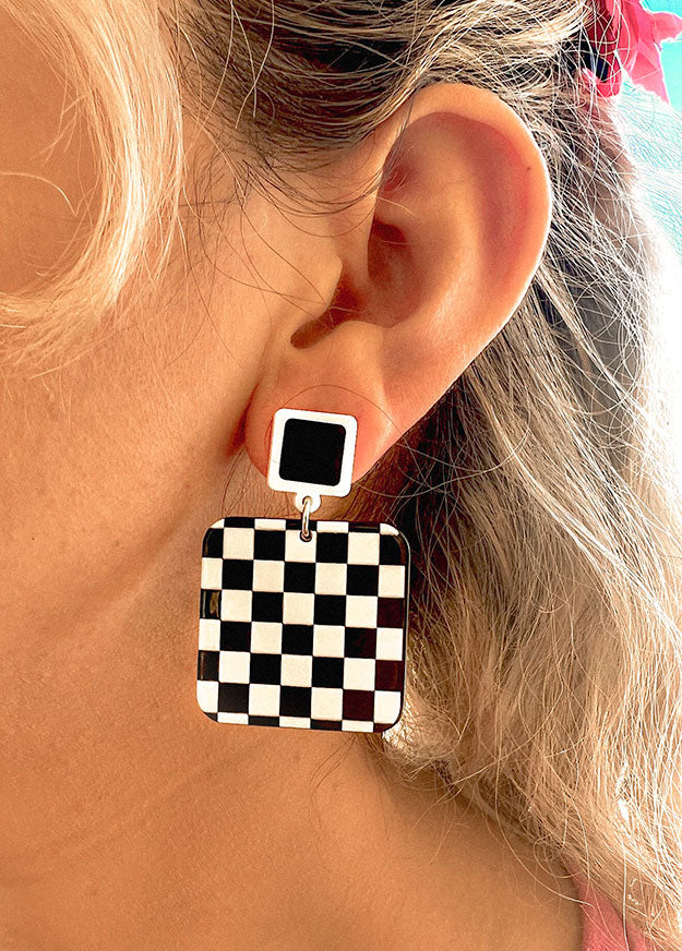 black and white checkered square acrylic earrings inspired by 80s retro racetrack fashion