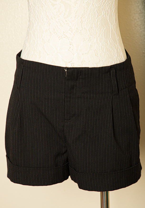 Vintage black and white pinstripe shorts size medium with cuffed hem and tailored fit ideal for vintage summer wardrobe
