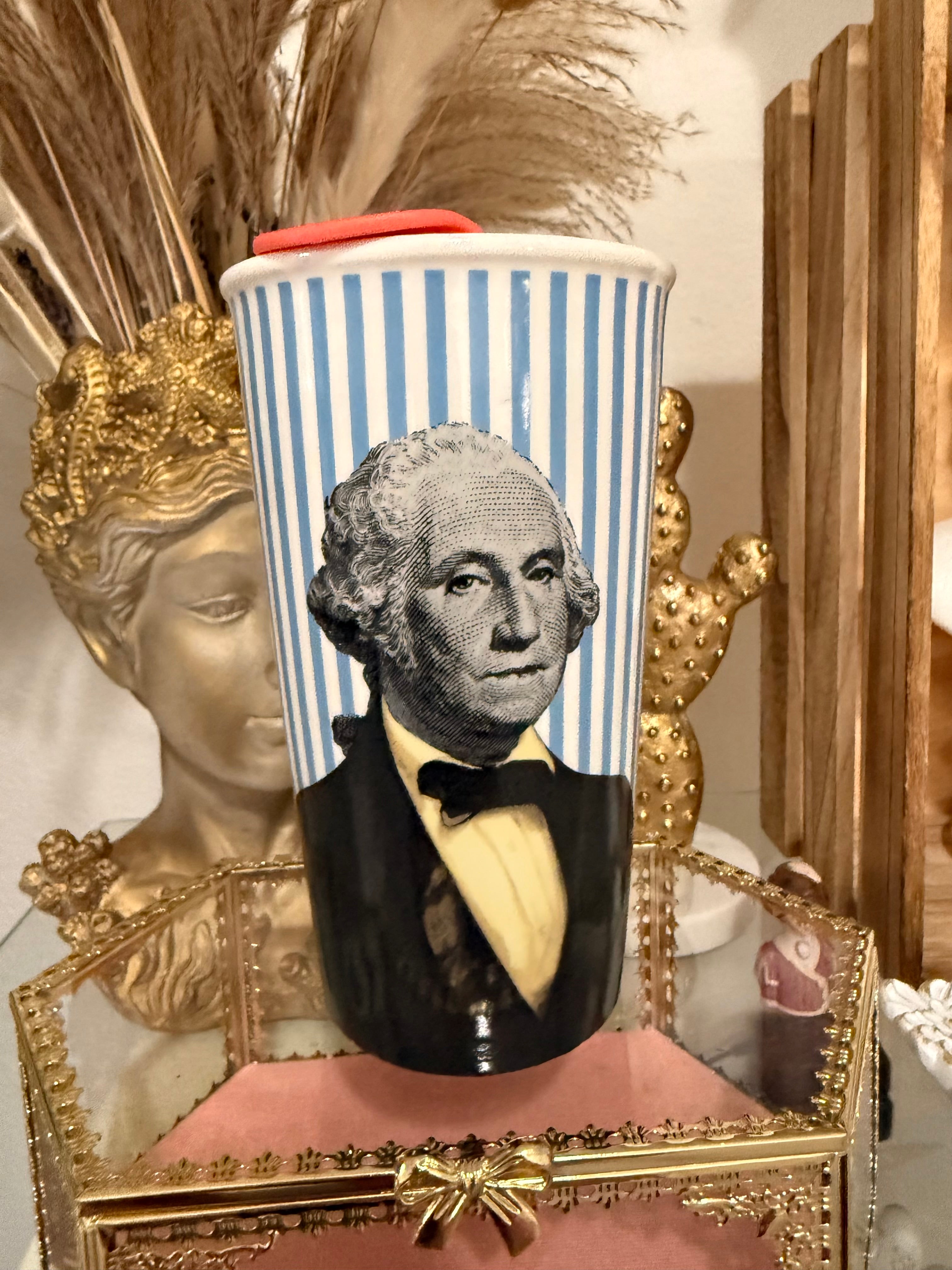Tumbler with a portrait of First President George Washington design on a decorative stand with gold accents