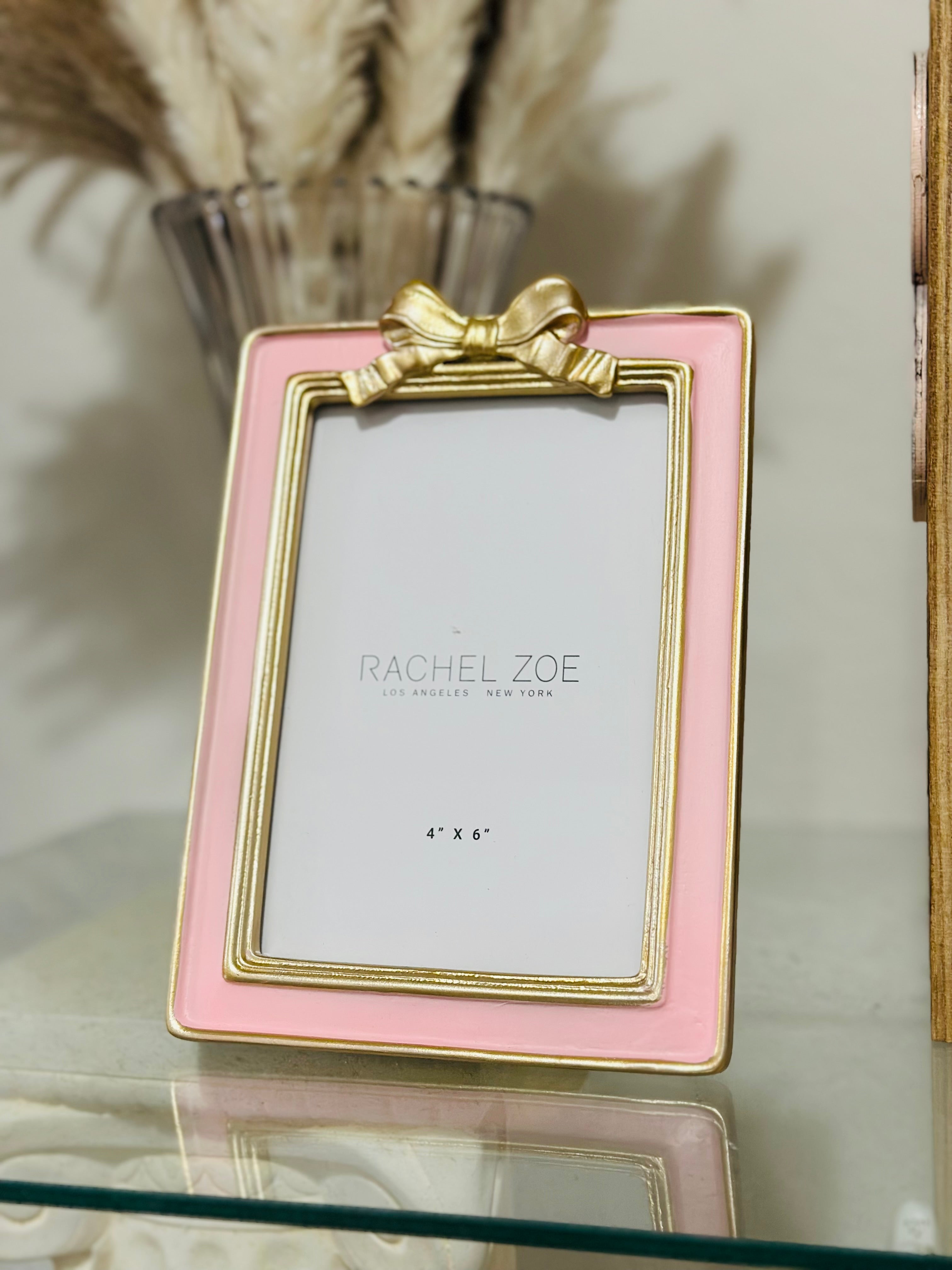 Barbie pink and gold bow picture frame, glamorous vintage home decor accent.