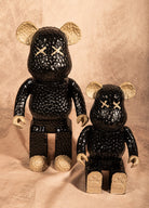 Set of two black and champagne Bearbrick-style bear statues, pop art modern home decor.