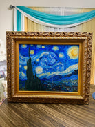 Framed Starry Night wall art with textured canvas brushstrokes in ornate gold frame, Van Gogh reproduction ready to hang.