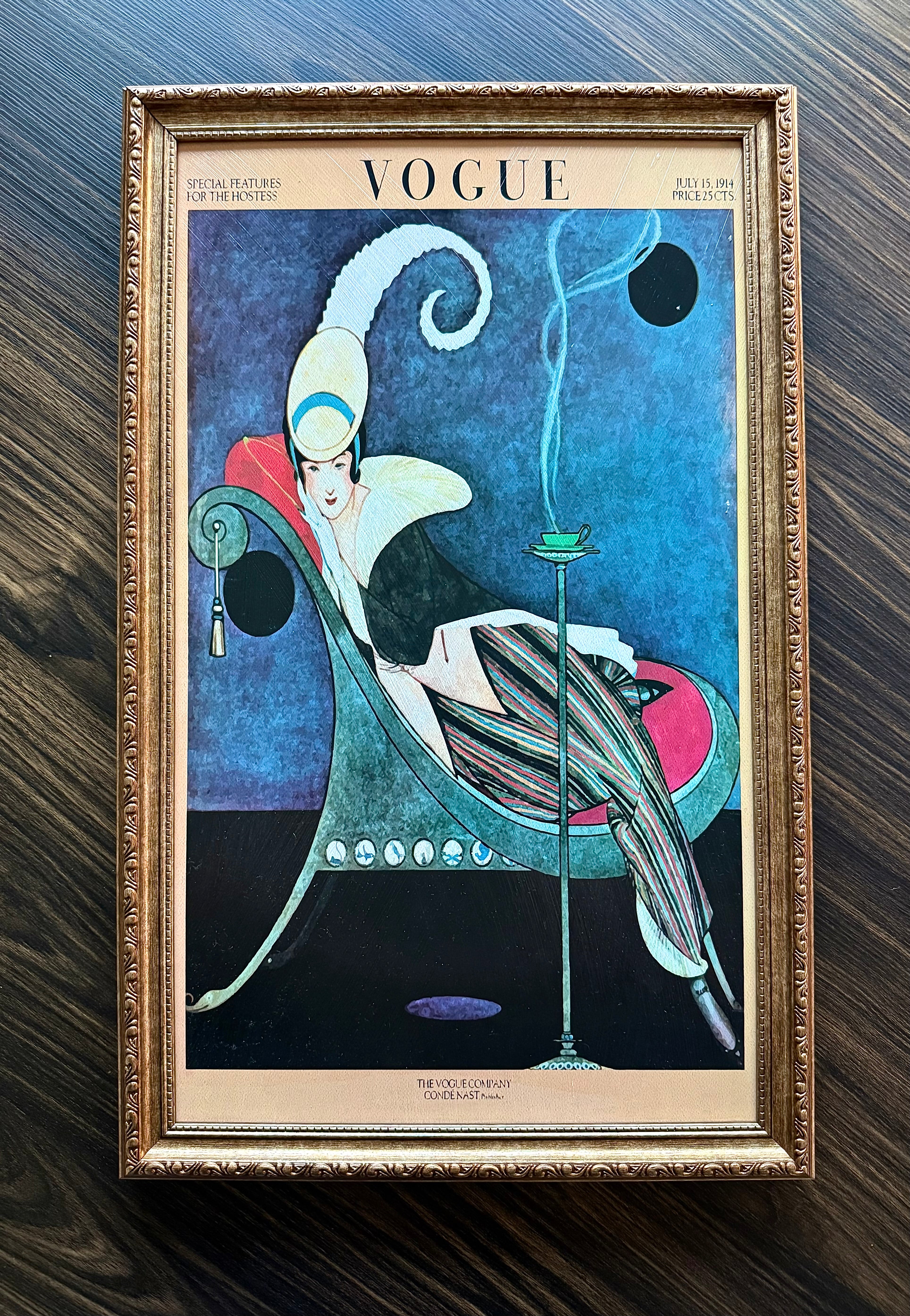 Framed vintage Vogue magazine cover from July 1914 in ornate antique gold frame featuring Old Hollywood fashion art wall décor.