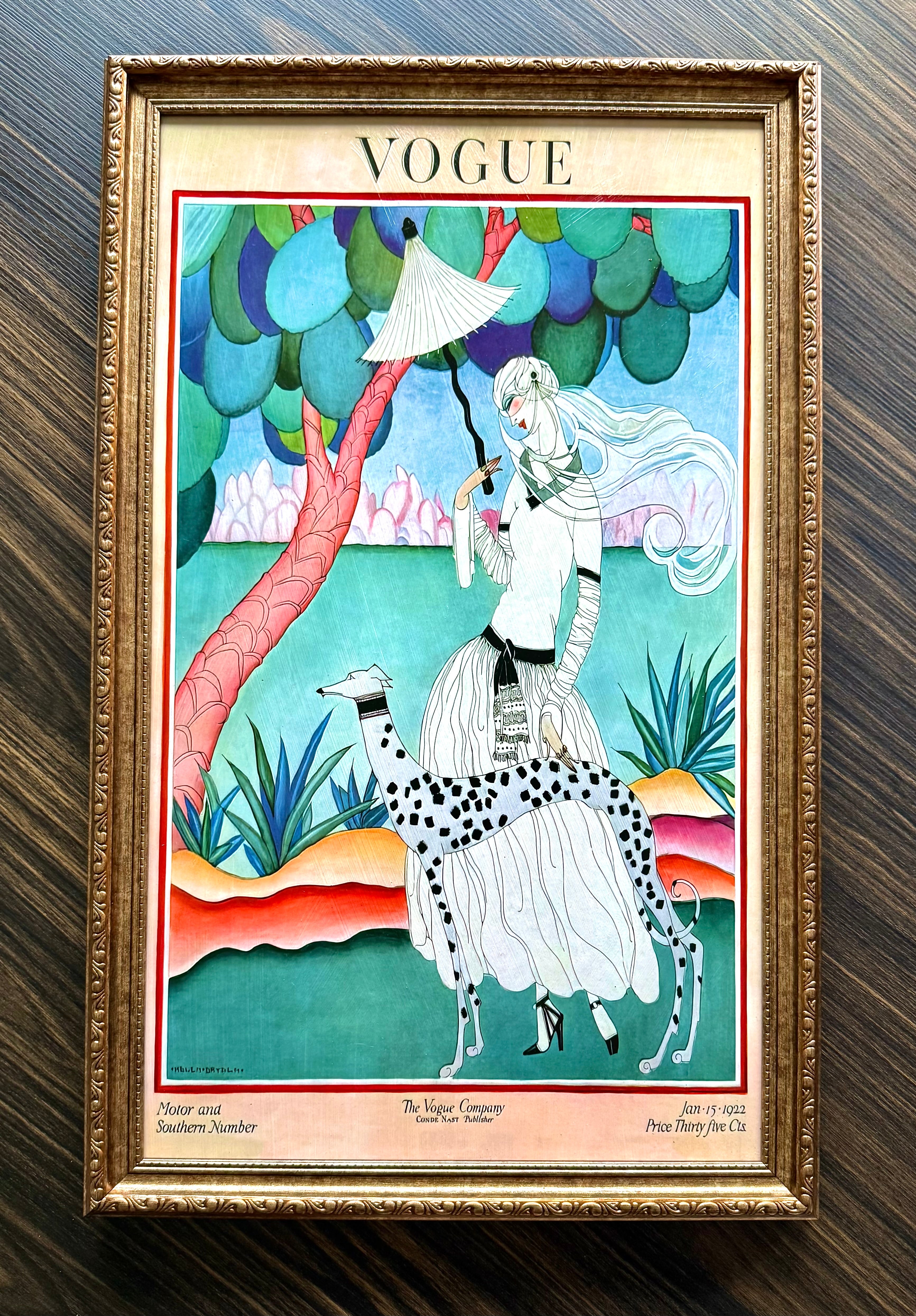 Framed Vogue Jan 15 1923 cover art featuring woman with parasol and spotted dog in ornate antique gold frame wall décor.