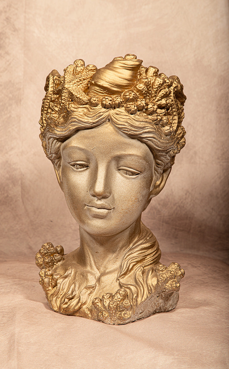 golden goddess bust statue adorned with seashell and coral crown on beige background, coastal mythology decor sculpture