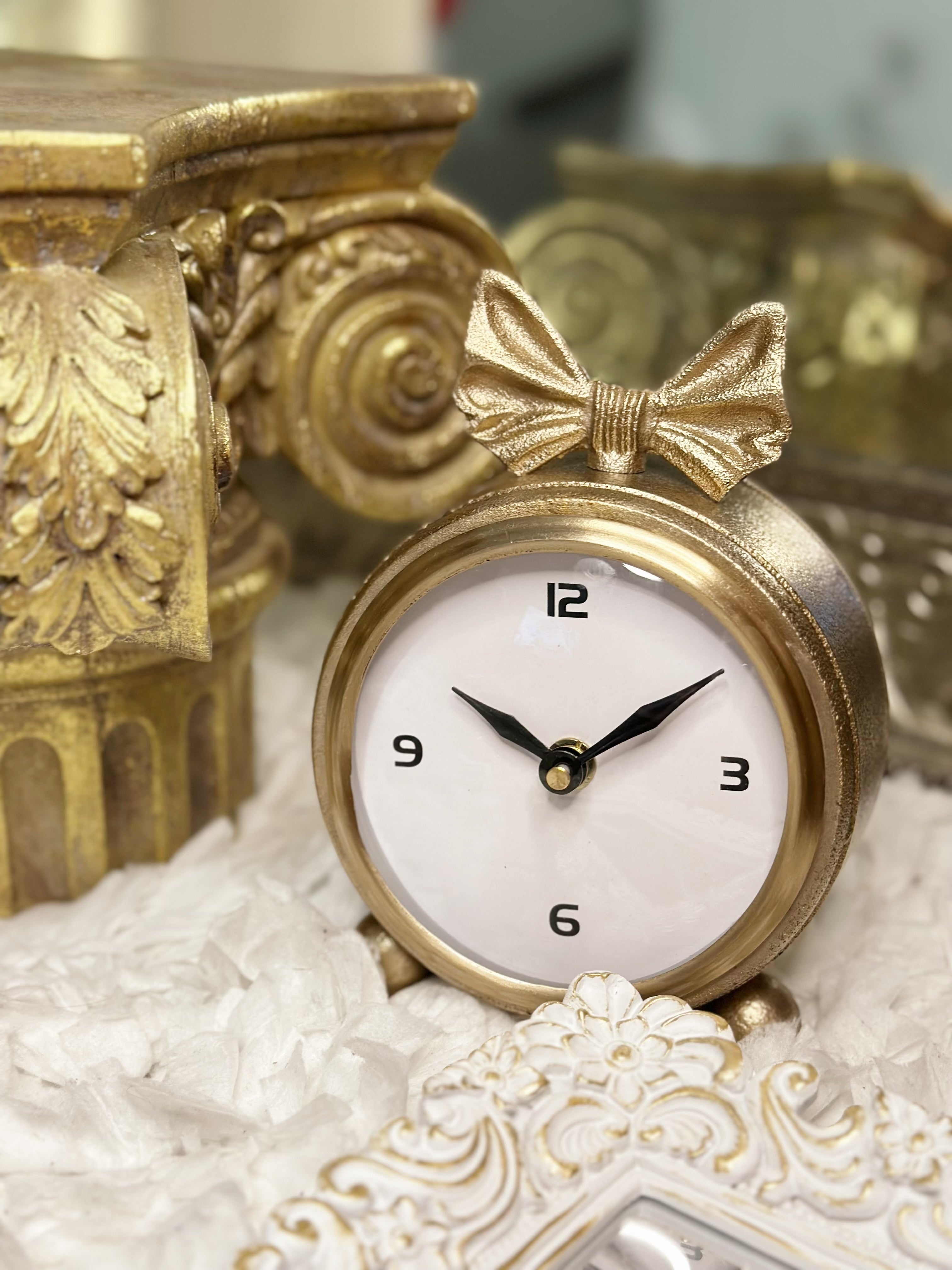 Gold vintage desk clock with bow detail, shabby chic Victorian home accent.