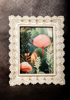 Vintage lace picture frame with romantic floral print, ideal for feminine wall art and shabby chic decor.
