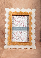 White rectangular picture frame with black bow, shabby chic vintage home accent.