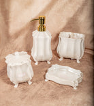 White porcelain Victorian-style 4-piece bathroom set with ornate curves and shabby chic look.