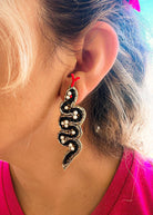 black and gold beaded snake twist earrings symbolizing rebirth and protection handmade boho jewelry